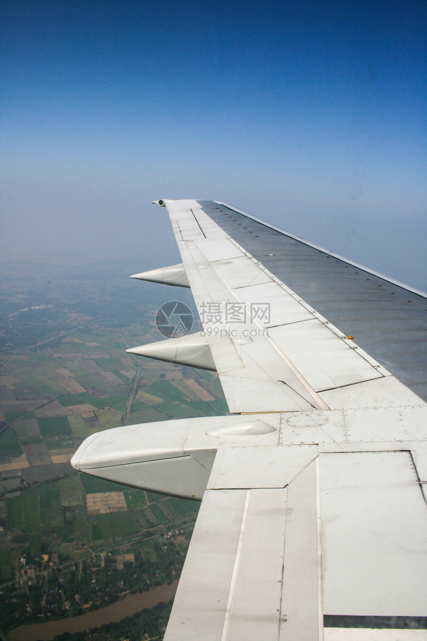 飞机飞行旅行地球假期窗户天空土地技术运输喷射风景图片