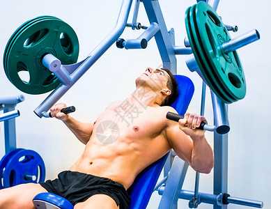 带有模拟器的正文构造器肩膀训练身体运动男人活动躯干二头肌肌肉锻炼背景图片