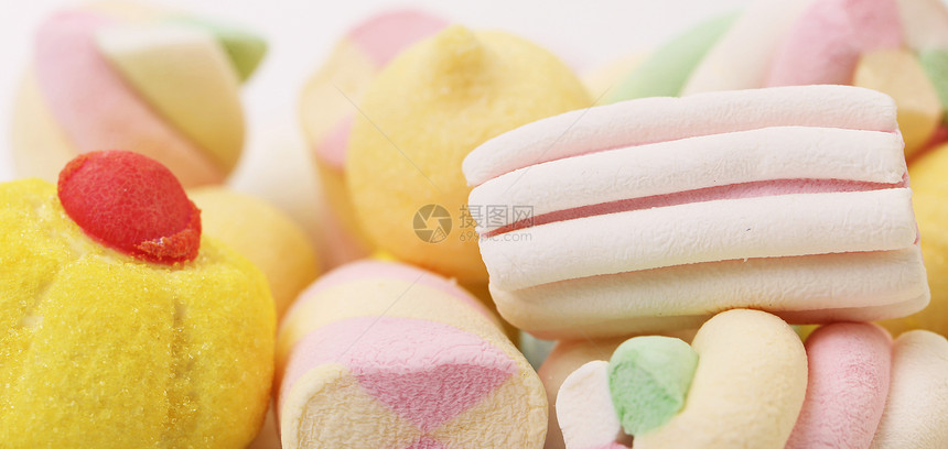 不同颜色的棉花糖甜点软糖乐趣孩子小吃黄色水果垃圾食物糖果图片