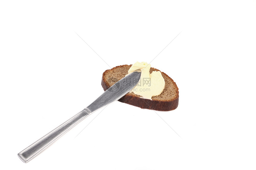 棕色面包上的黄油刀营养盘子午餐小吃粮食传播小麦饮食黄油白色图片