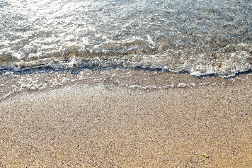 沙子挥舞在海面上海浪棕色海洋旅行支撑假期蓝色冲浪黄色情调图片