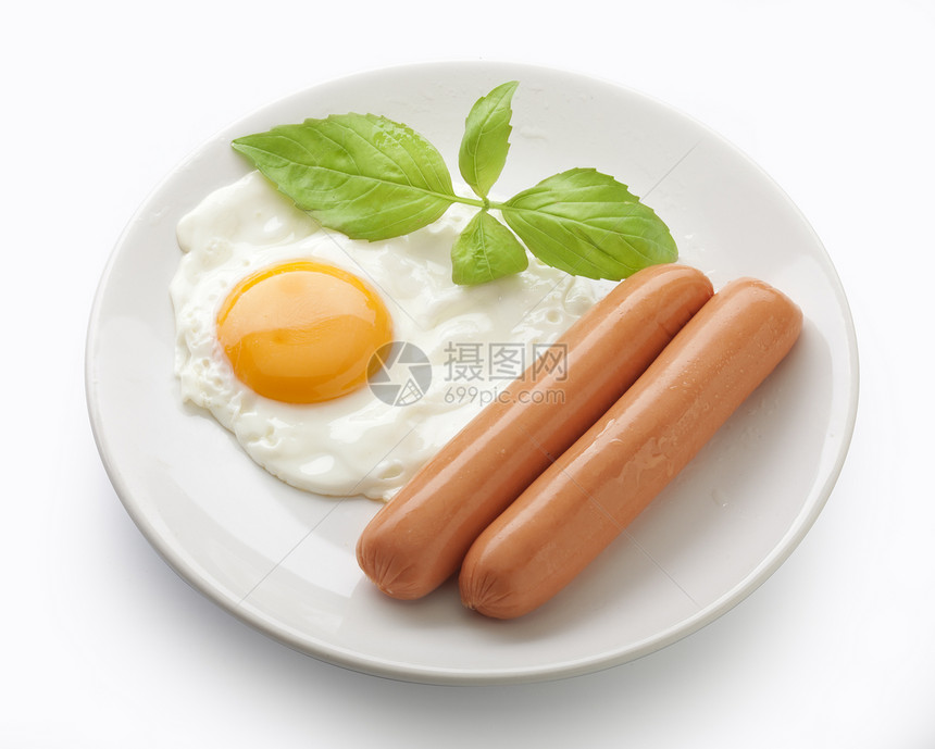 香肠和煎蛋油炸早餐白色绿色食物盘子图片