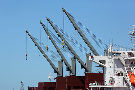 船舶起重车起重机橙子货物金属机械码头天空电缆救生艇工作背景图片
