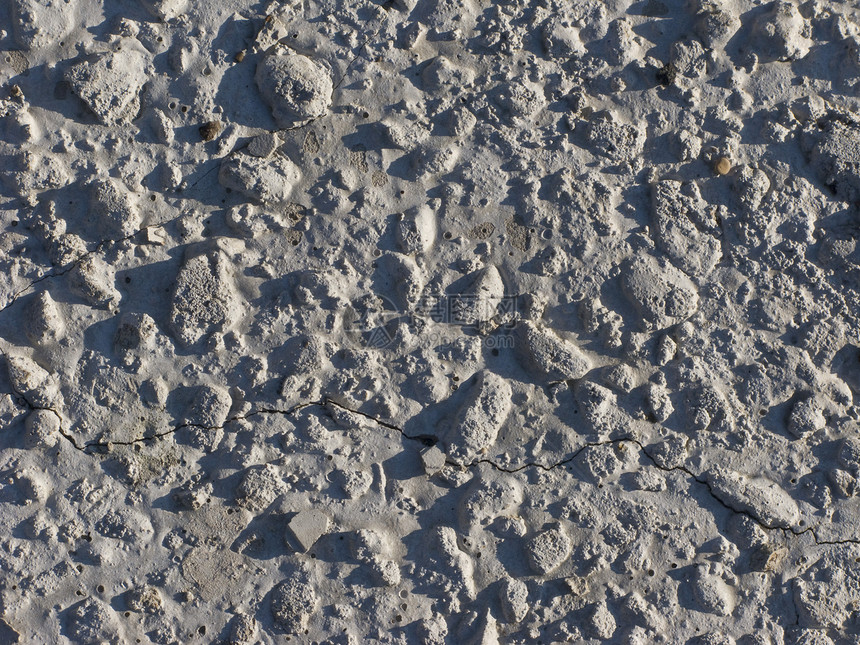灰色混凝土背景粒状石头壁画异质矿物碎石墙纸卵石滑轮水泥图片