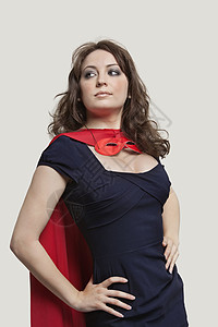 穿着彩色超级英雄穿着超级英雄服装的漂亮女人 穿着灰色背景的衣服背景