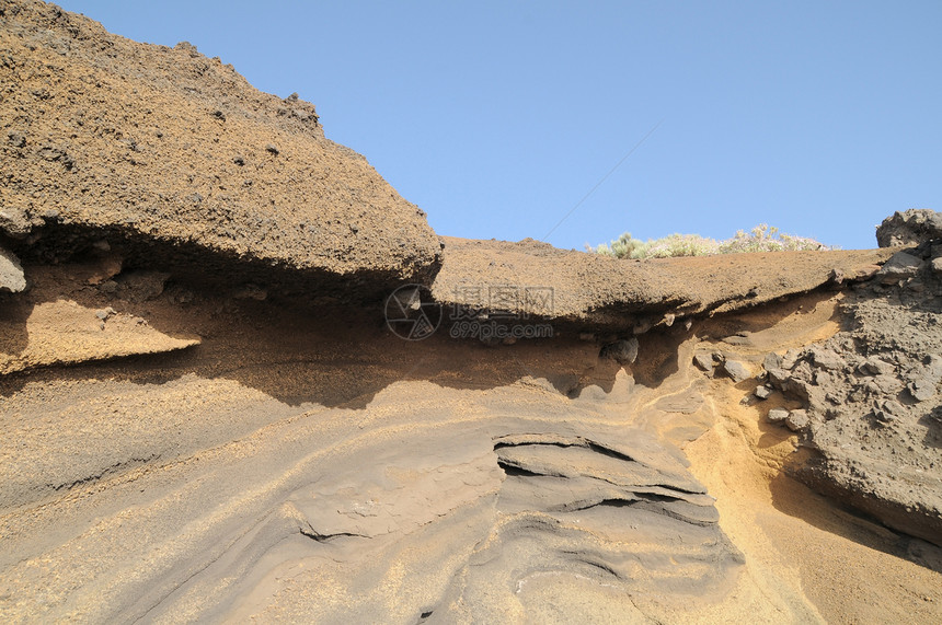 古代火山岩蓝色海洋岩石石头历史侵蚀太阳地球旅行海滩图片