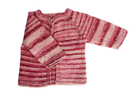 白色的婴儿羊毛衫红色孩子衣服手工羊毛服饰背景图片