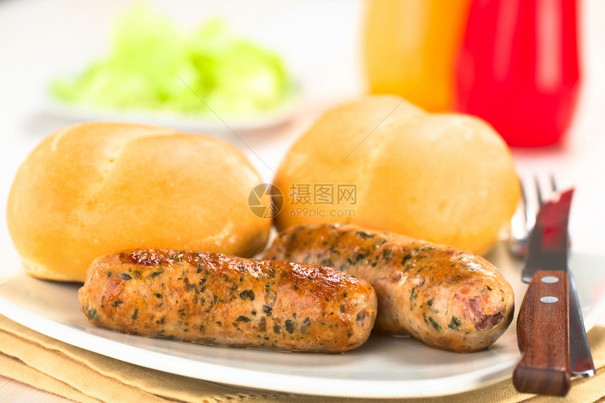 与Bun一起的猪肉草本植物油炸包子食物小子刀具小吃午餐水平图片