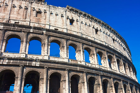 蓝色条纹的罗马帘罗马的巨集蓝色历史性竞技场石头旅行体育馆旅游角斗士天空废墟背景