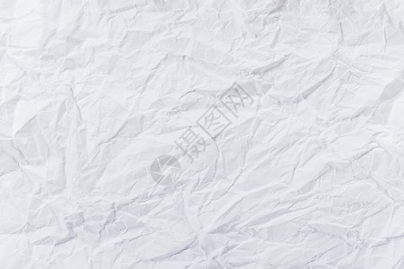 弄皱的白折面纸白色卡片纸板材料皱纹织物折痕床单羊皮纸背景