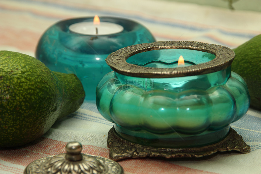 美丽的花瓶 东方风格的蜡烛金属蓝色宗教色调绿色图片