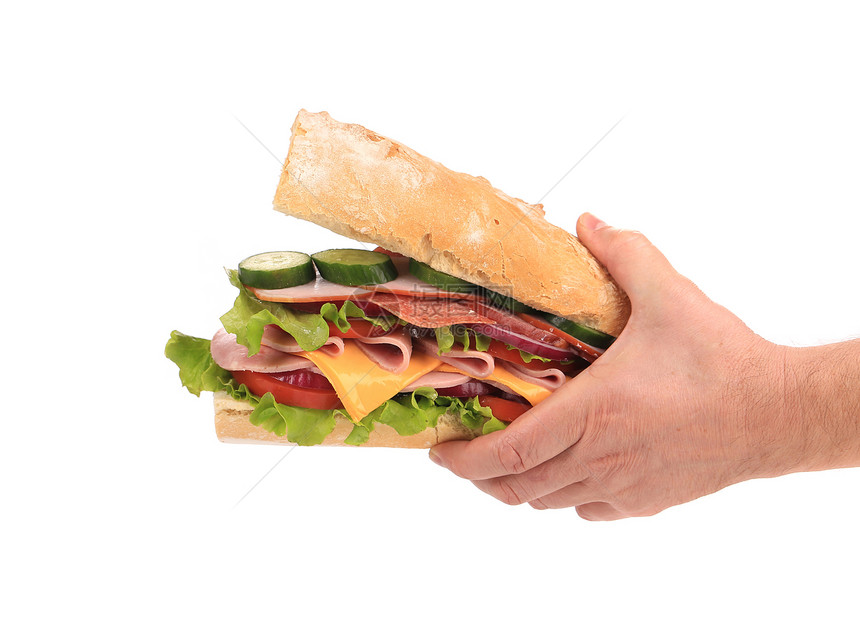 新的大三明治在手里食物火腿家禽熏制蔬菜黄瓜芝麻沙拉小吃洋葱图片
