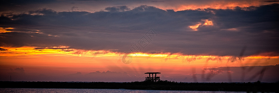 梅里特日落水平太阳橙子反射风景全景天空旅游场景摄影背景