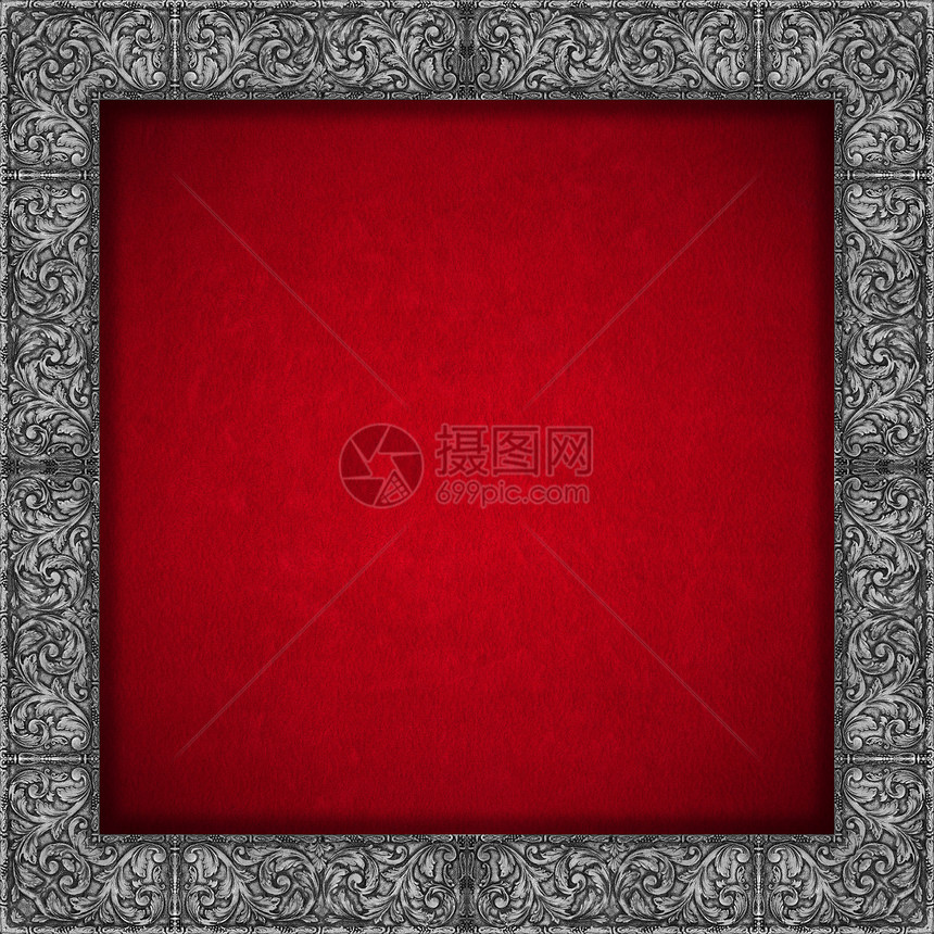 红色天鹅绒背景上的银花框架图片