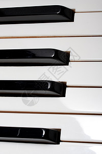 钢琴乐器键盘旋律音乐会声学钥匙黑色象牙白色笔记背景图片