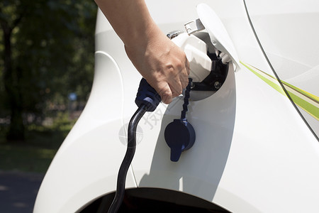 电池汽车电动汽车充电方式电源电源线喷嘴人手收费插头汽车工业马达电动车背景