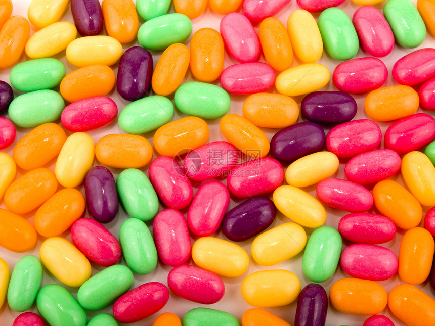 色彩多彩的糖果背景背景粉色孩子紫色小吃橙子绿色黄色团体食物图片