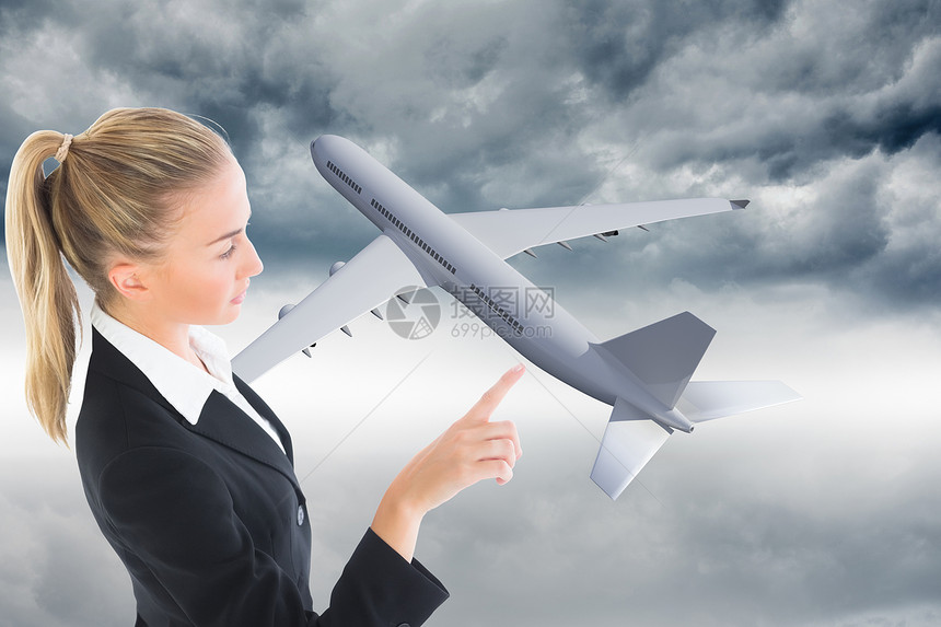 商业妇女指向某处的复合形象女士航班人士计算机假期航空套装飞行旅游头发图片