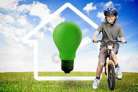 在公园里骑自行车的小男孩的 综合形象骑术蓝天微笑草地绘图创新灯泡享受闲暇绿色背景图片