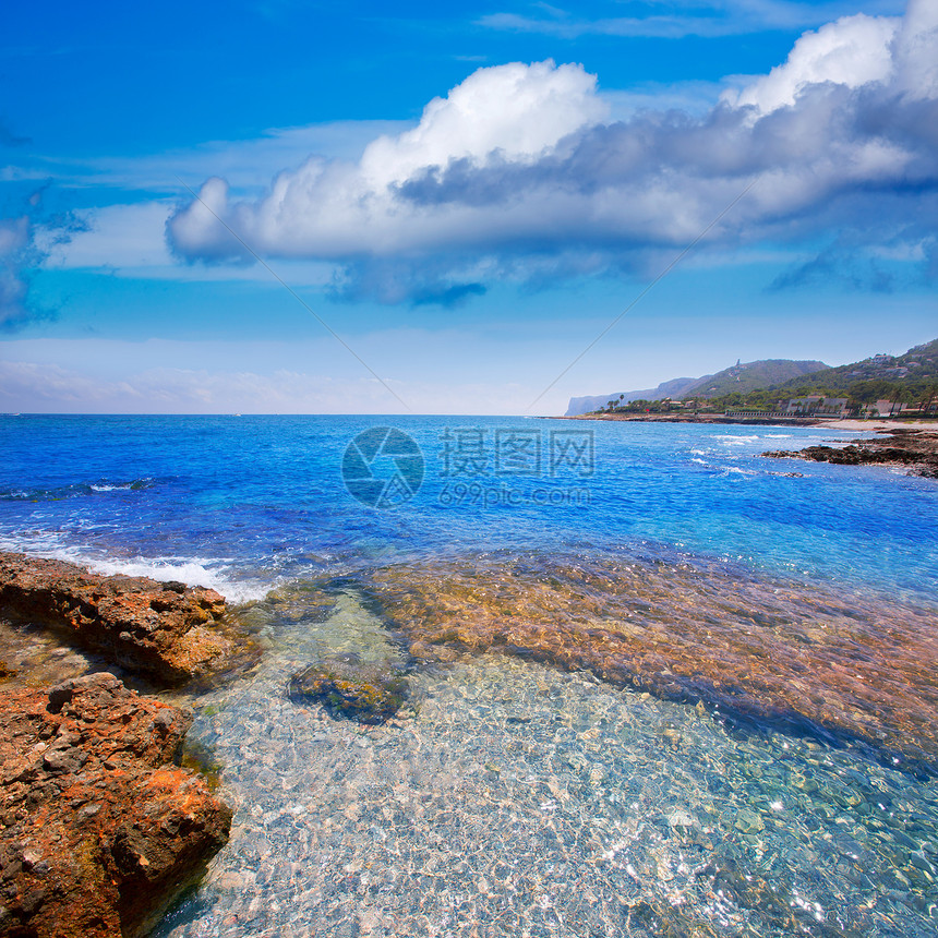 西班牙的轮状岩石海滩天气地平线环境石头地标景点海洋海浪波纹太阳图片