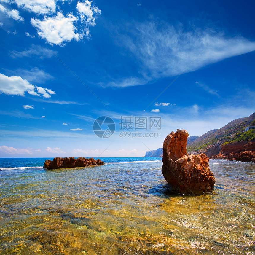 西班牙的轮状岩石海滩地平线旅行波纹地标太阳海洋景点海浪蓝色支撑图片