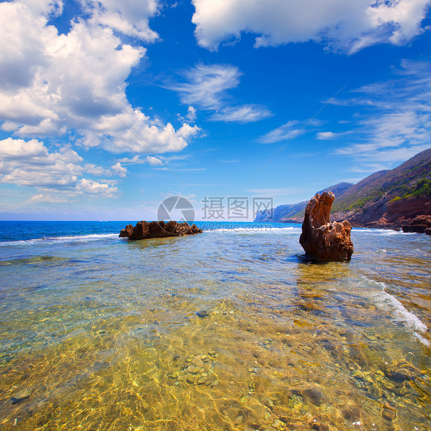 西班牙的轮状岩石海滩地平线波纹支撑环境地标海岸蓝色天气石头旅行图片