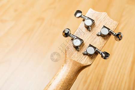 Ukulelele夏威夷吉他公司董事长音乐家机器歌曲民间木头文化吉他旋律黑色指板背景图片