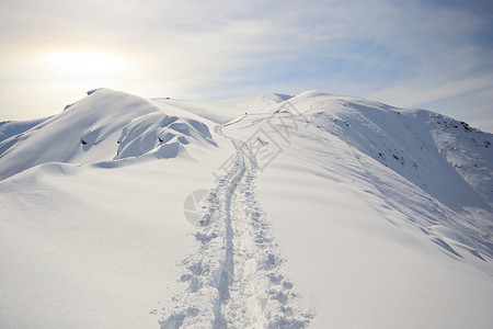 技术熟练愿望成就活动粉雪风景山脉冰川雪鞋滑雪天空背景图片