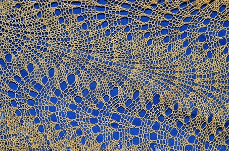 蕾丝黄色织物钩针针织蓝色手工工艺花边背景图片