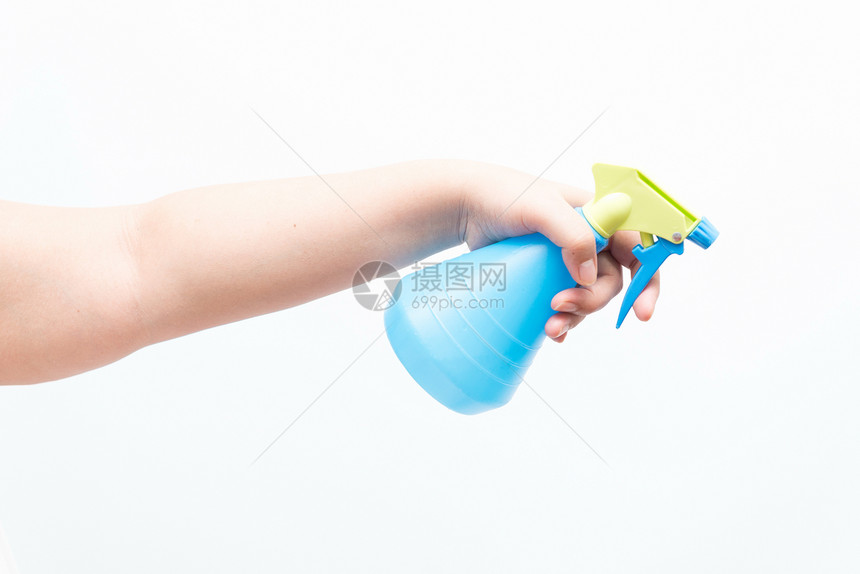 使用喷水器熨烫的亚洲妇女女孩手势女士积分喷雾器白色手指工作室蓝色图片