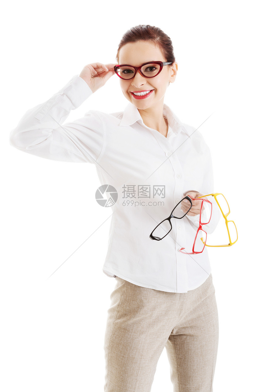 美丽的女人在眼镜里 拿着三双不同的毛衣验光师成人镜片眼科医生框架验光推销员眼睛黑色图片