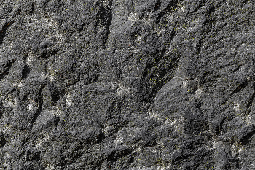 具有坚固结构的天然石块花岗岩墙火山大理石宏观织物缺陷视图岩石石头静脉矿物图片