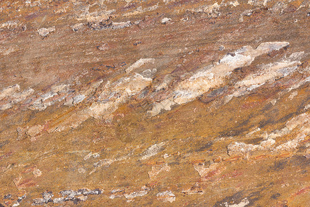 黄色石块的纹理砖墙粮食岩石花岗岩矿物大理石石头石灰石宏观平板背景图片