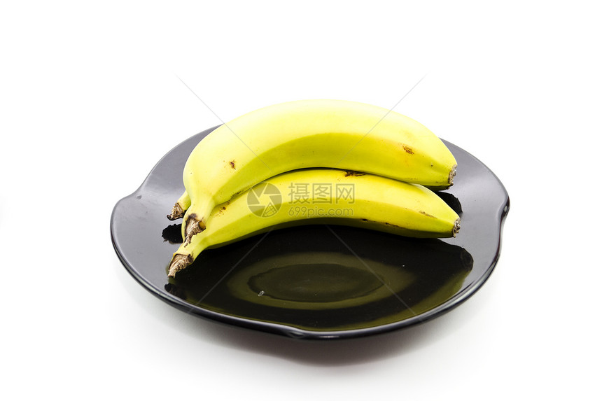 黑色陶瓷板上的新鲜黄色香蕉新鲜度盘子饮食食物水果陶瓷食品图片