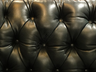 皮革索法家具纽扣螺柱椅子座位黑色背景图片