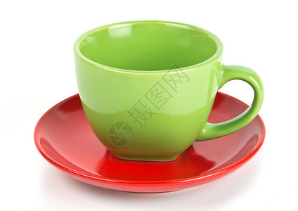 茶杯杯子白色盘子红色飞碟绿色背景图片