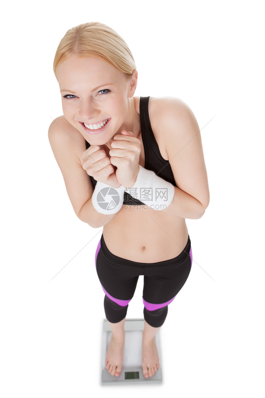 身负重重量的健身女工健身房女性金发女郎微笑胜利数字女孩火车营养重量图片
