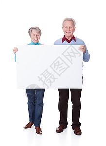 高级夫妇控股白板牌展示保险男人微笑夫妻退休工人女性幸福横幅背景图片