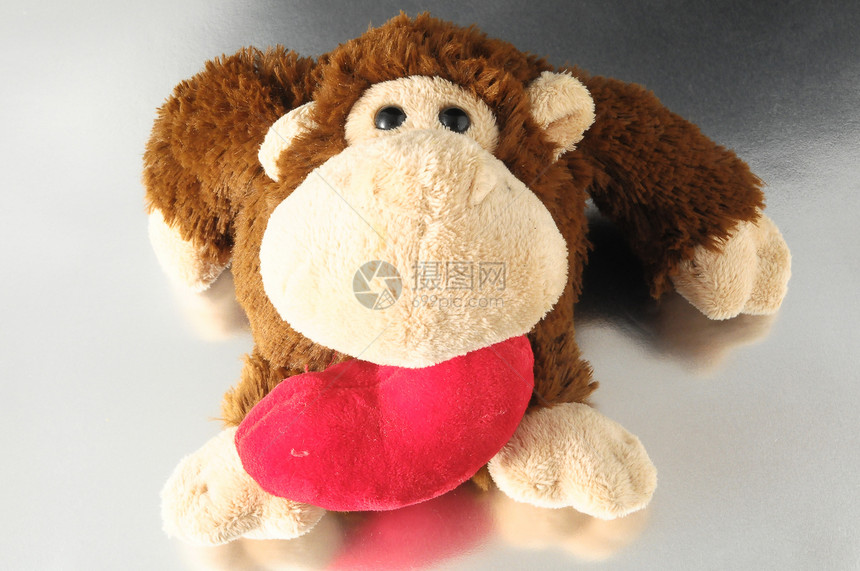 有趣的棕色猴子娃娃玩具玩具熊手工针织羊毛礼物微笑白色动物图片