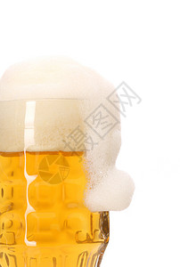 圣诞帽子作为泡沫 在大杯啤酒流动气泡饮料庆典玻璃黄色文化液体酒精背景图片