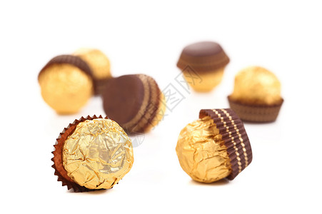 一堆巧克力金盆子食物饼干白色金子糖果糕点甜品甜点飞碟背景图片