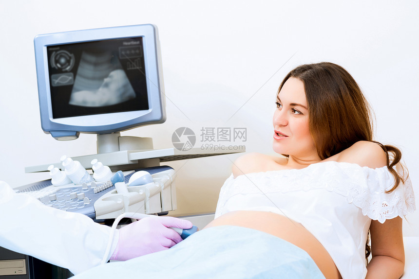 接受医生诊治的怀孕妇女女士咨询病人家庭婴儿顾问成人考试女性卫生图片