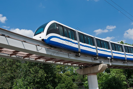 蓝色火车单轨列车旅行技术城市交通乘客建筑学车站车辆过境蓝色背景