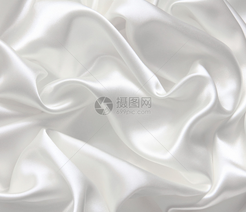 作为婚礼背景的平滑优雅白色丝绸新娘布料涟漪织物纺织品折痕银色材料海浪曲线图片