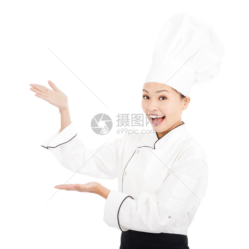 年轻有美貌的女人 打扮成一个带帽子的厨师图片