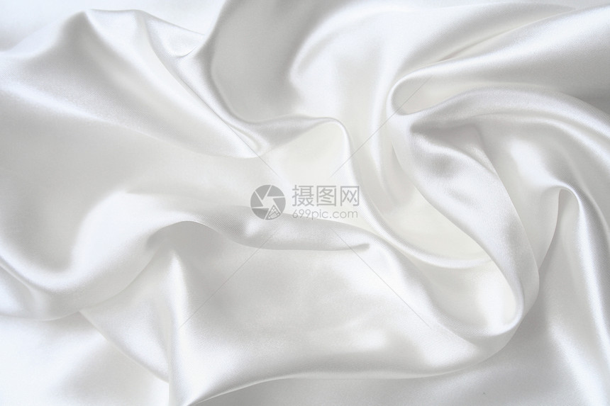 作为婚礼背景的平滑优雅白色丝绸海浪纺织品投标布料织物折痕涟漪银色材料曲线图片