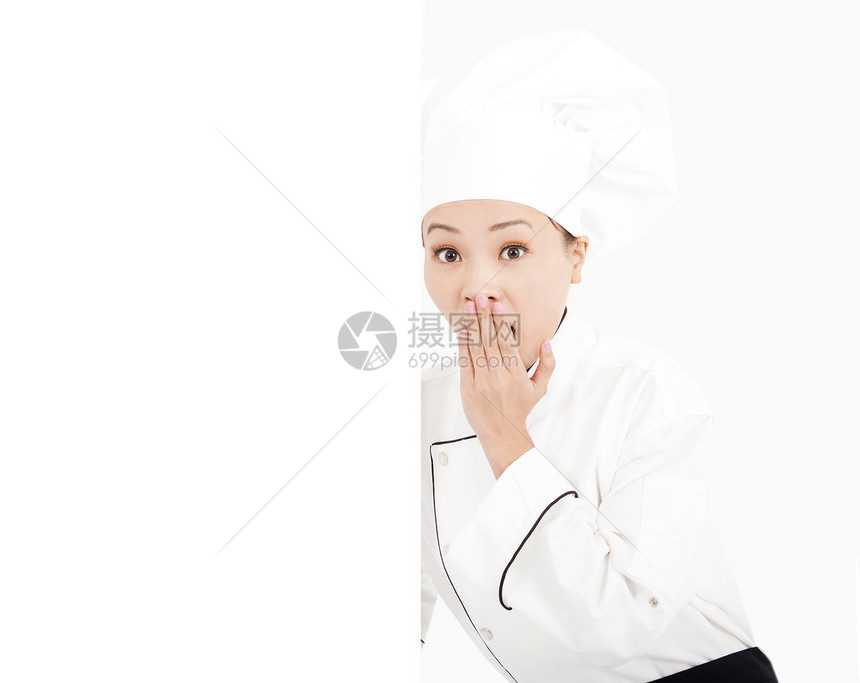 令人惊叹的年轻女厨师 看着空白板图片