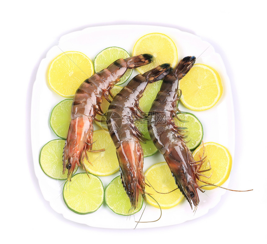 盘子里有生虎虾饮食甲壳美食黄色动物柠檬贝类营养海鲜绿色图片