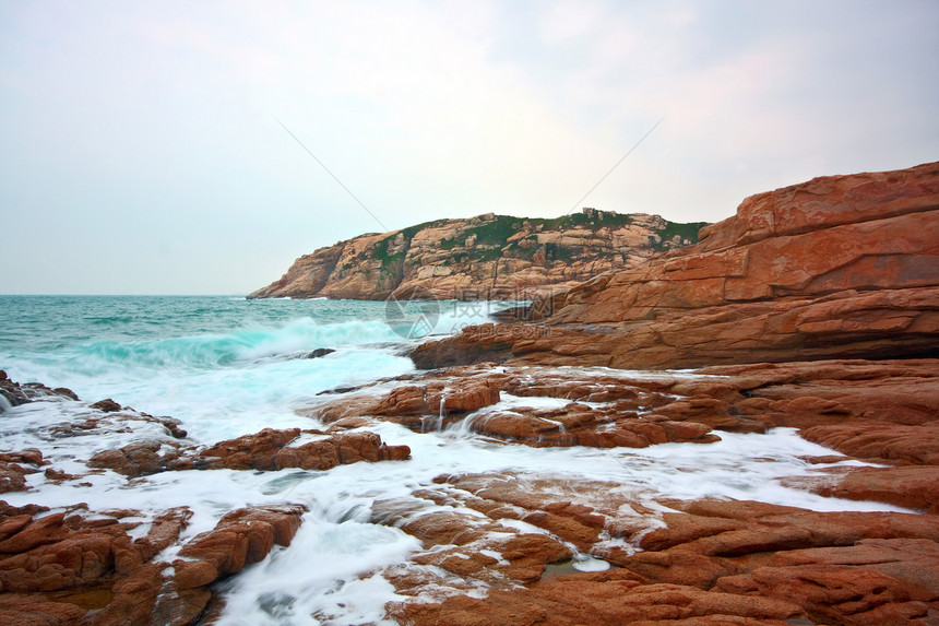 岩石海岸和深水中模糊的水 香港天空海岸线旅行蓝色热带假期阳光日落太阳季节图片