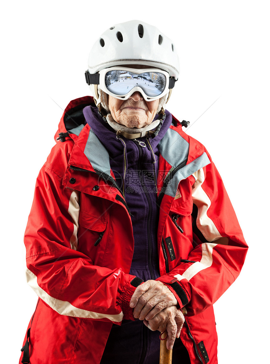 身穿滑雪夹克和头盔的高级妇女图片